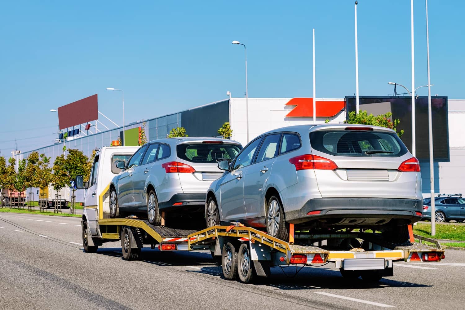 car-carrying-trailer-with-new-vehicles-asphalt-road-slovenia