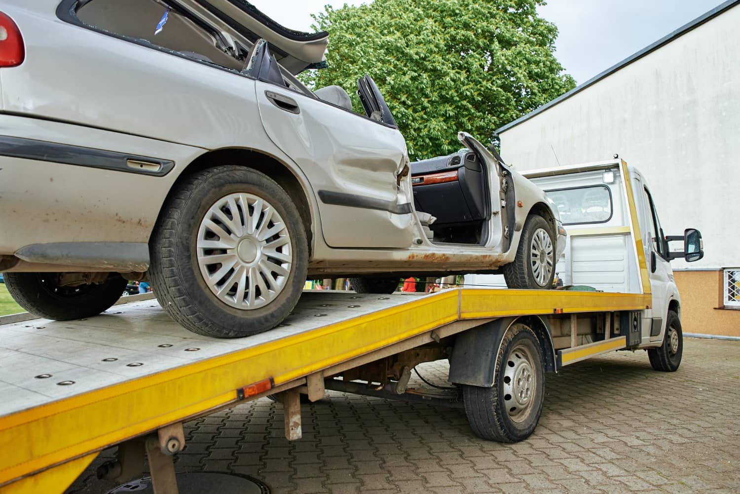 wrecked-car-loading-tow-truck-after-crash-traffic-accident-concept-dangerous-driving-after-dri